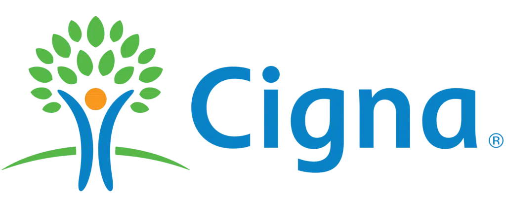 Cigna logo featuring a stylized tree with green leaves, a blue trunk, and an orange circle, next to the word Cigna in blue text.